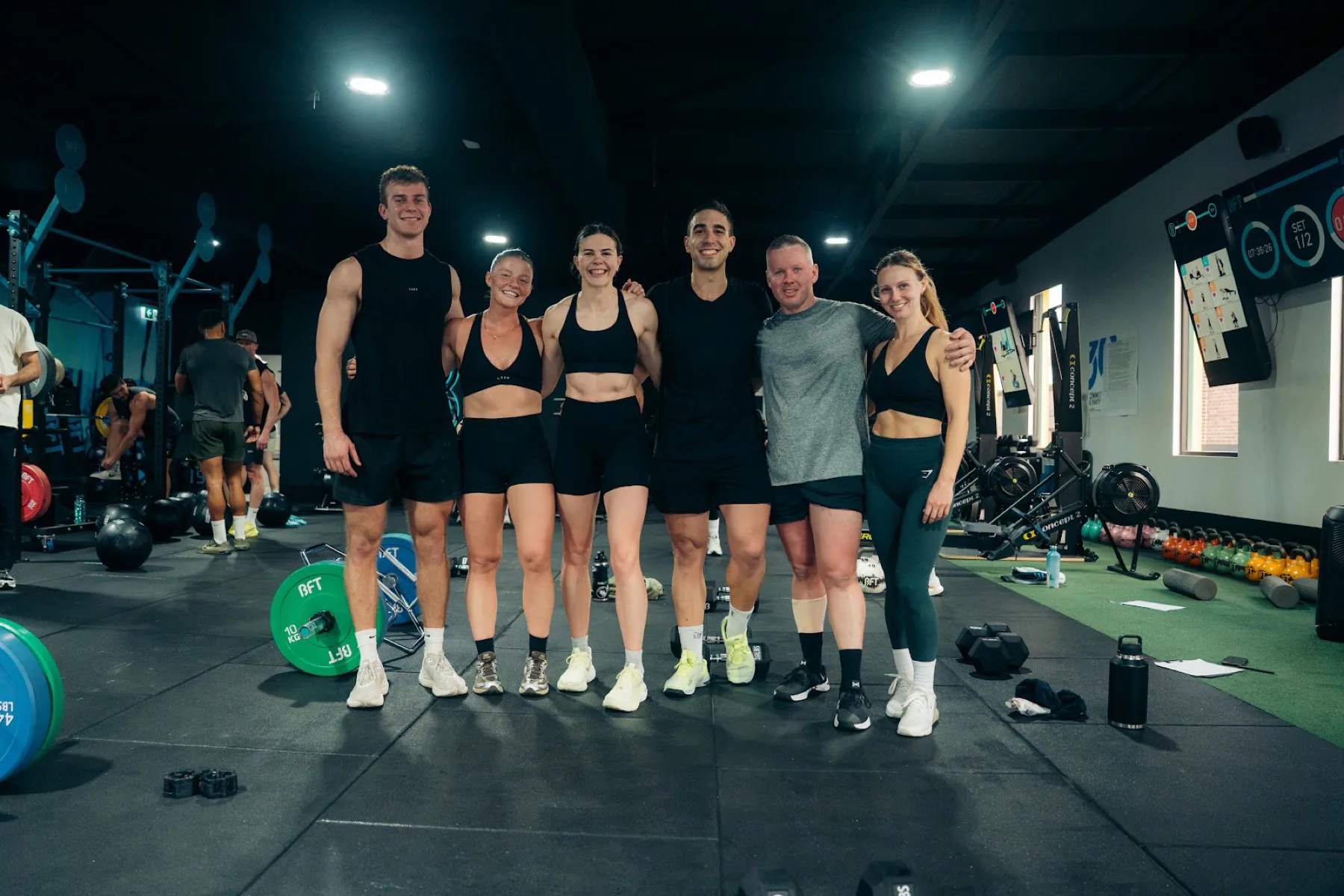 Six BFT Leichhardt members smiling together in the studio